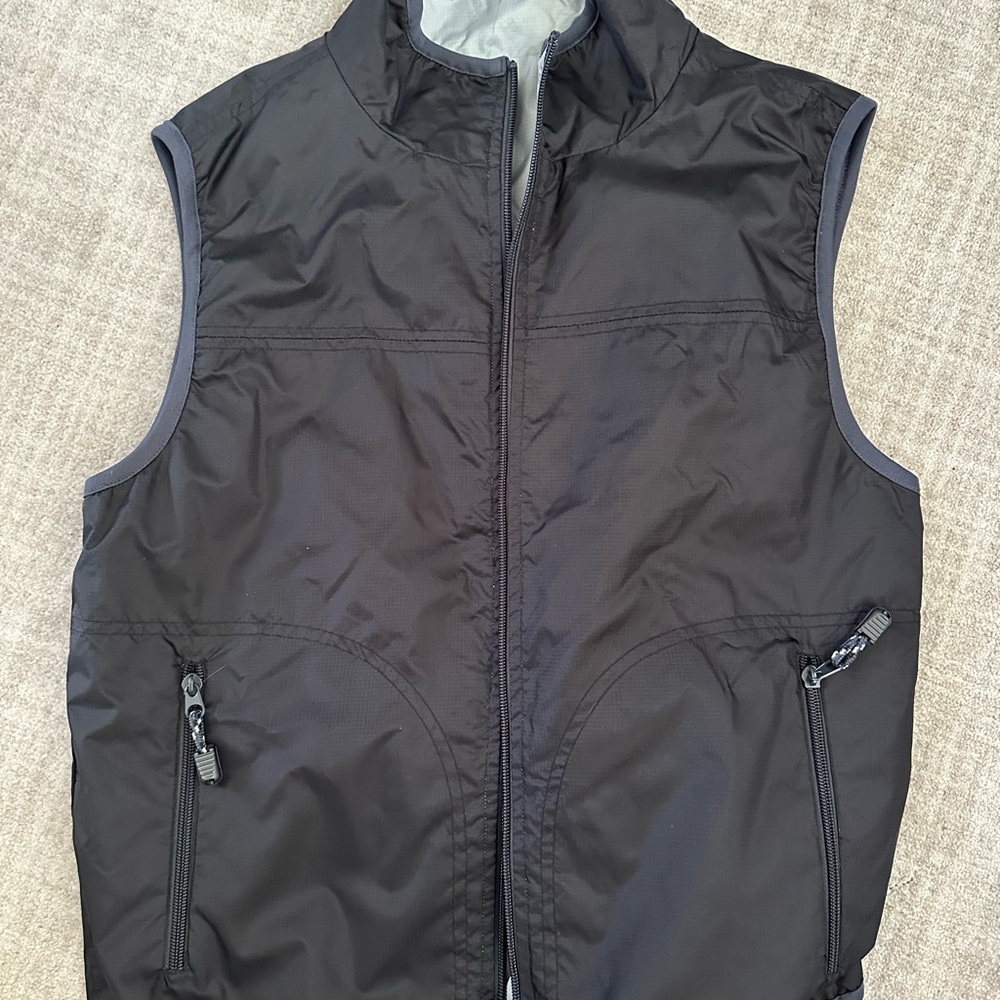 Black Sleeveless Vest with Stand-Up Collar.  No flaws; great condition.